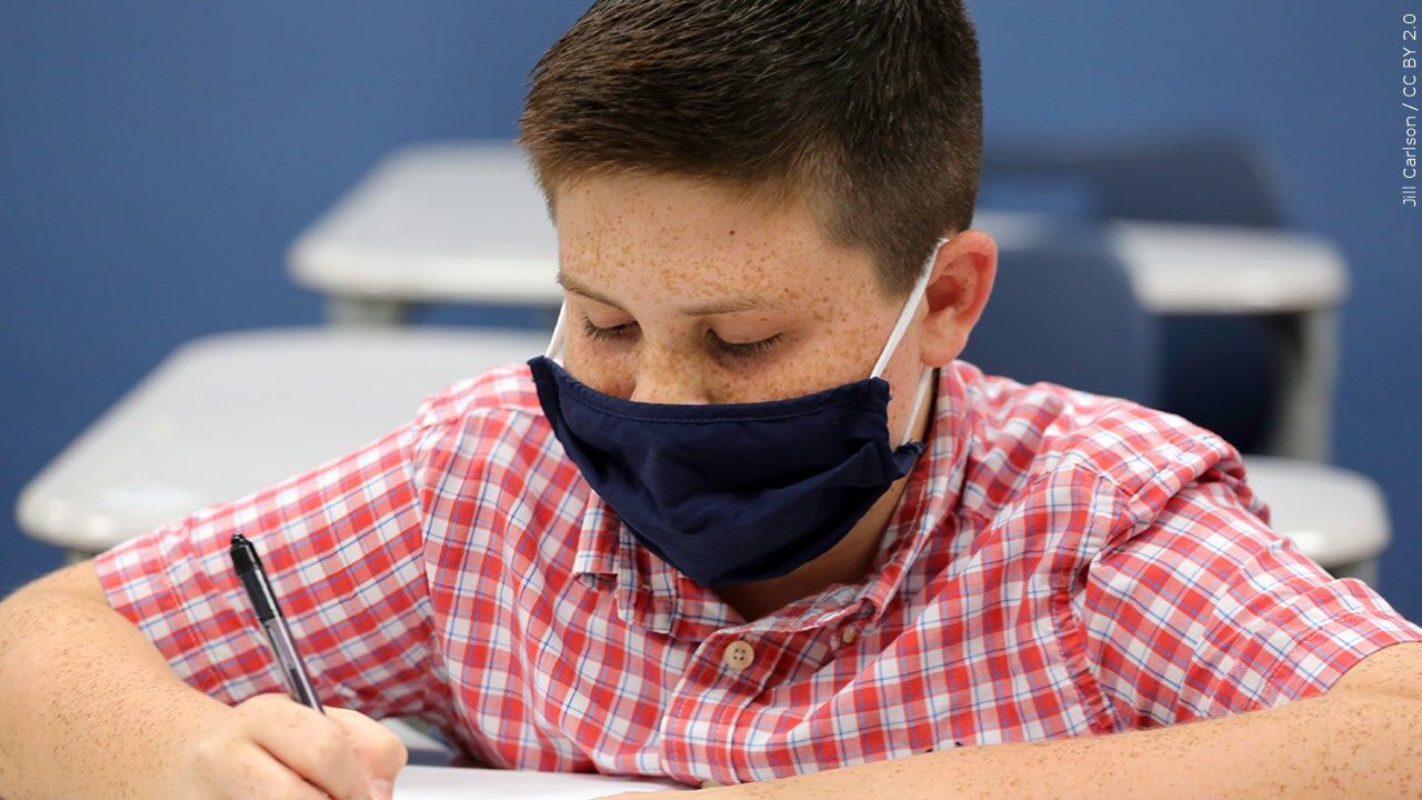 student wearing a mask in school mgn